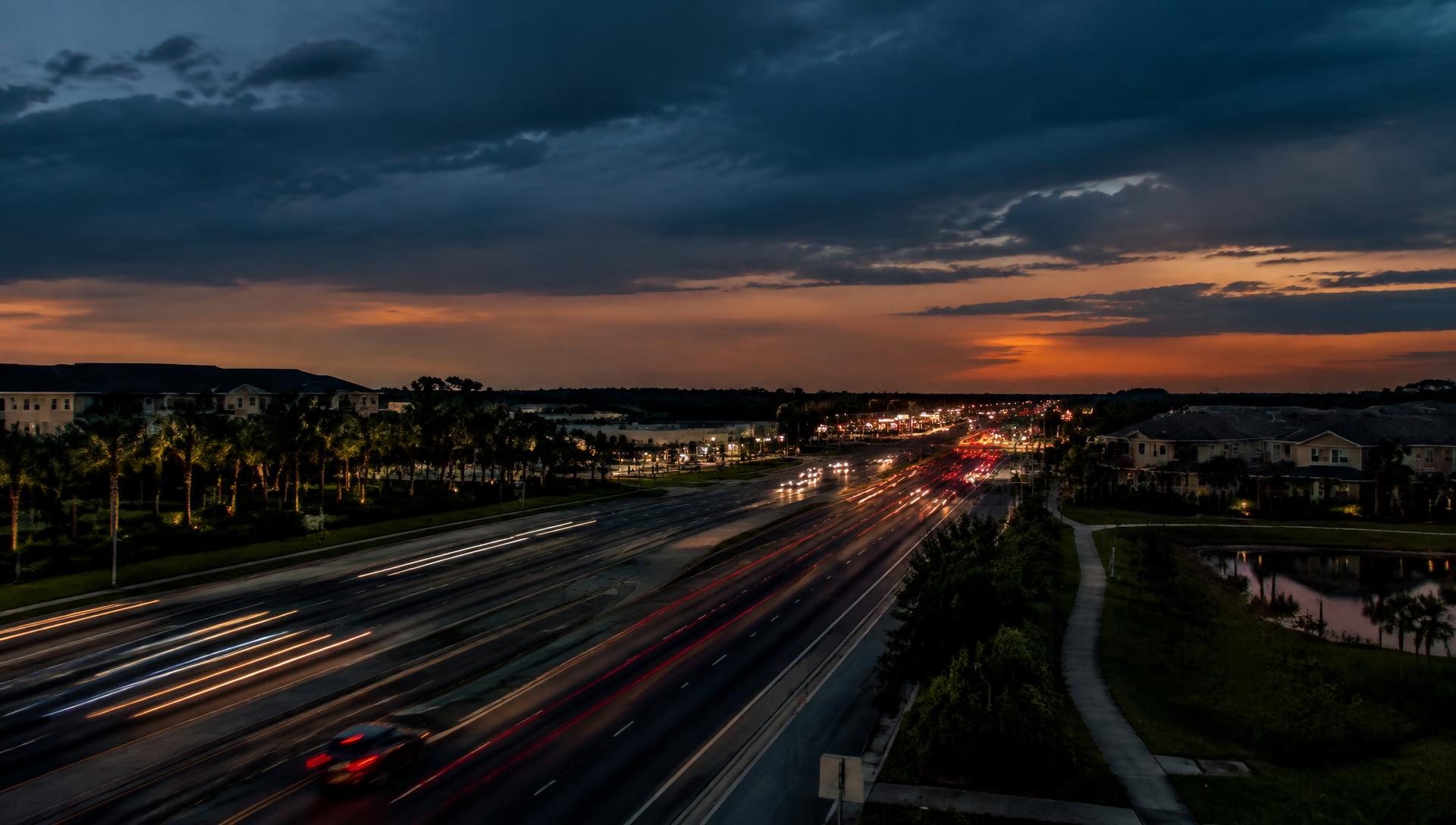 Busy Central Florida highway corridor at dusk